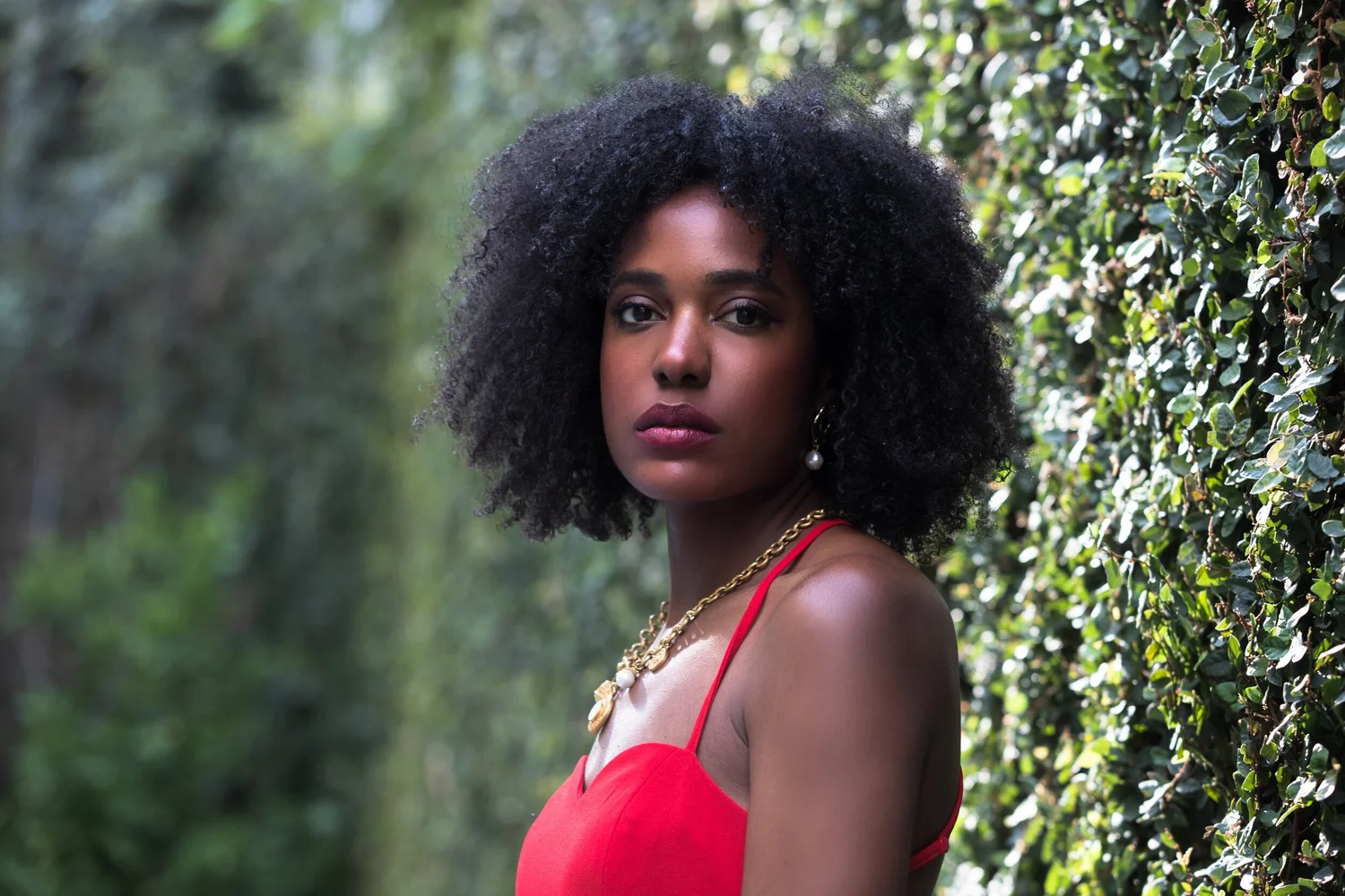 Zoë’s professional portrait in a red dress